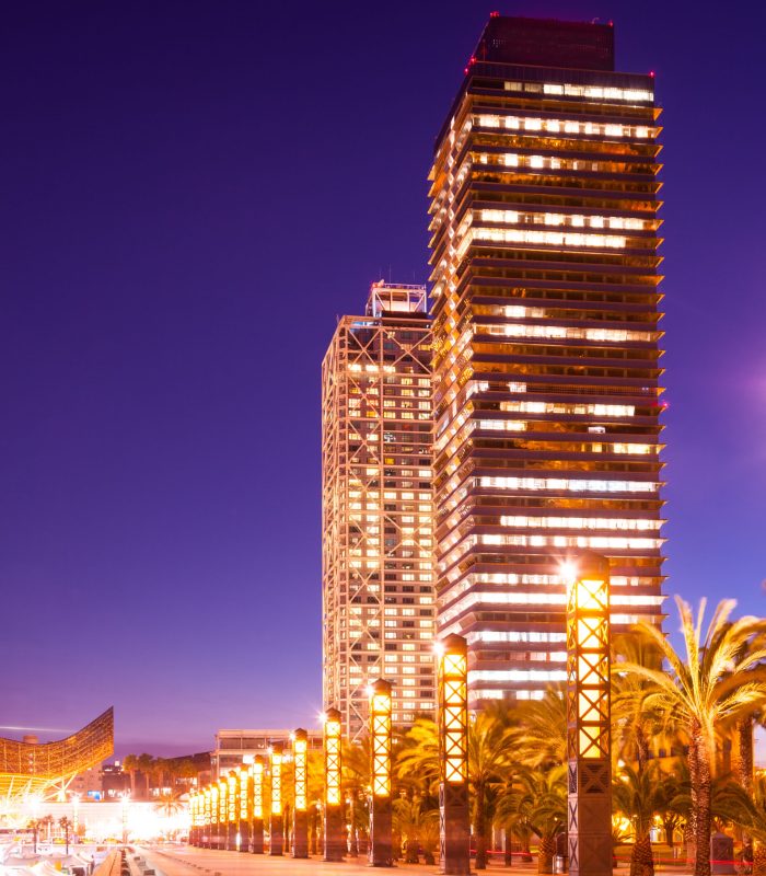 night view of skyscraper in Port Olimpic - center of nightlife at Barcelona, Spain